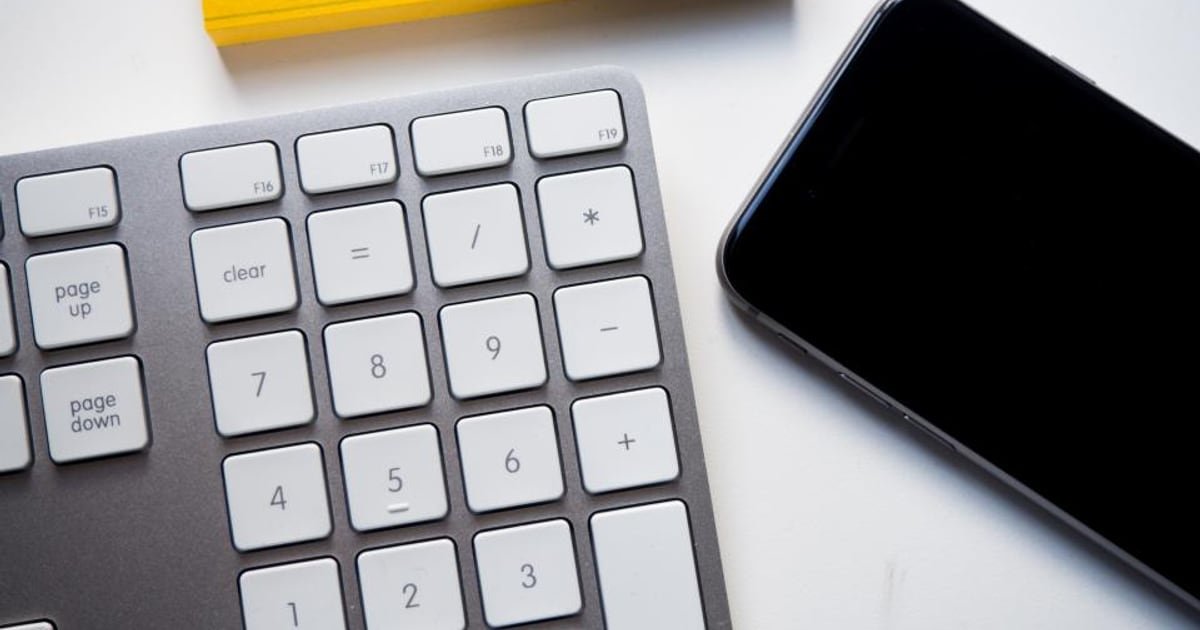 A keyboard on an office desk