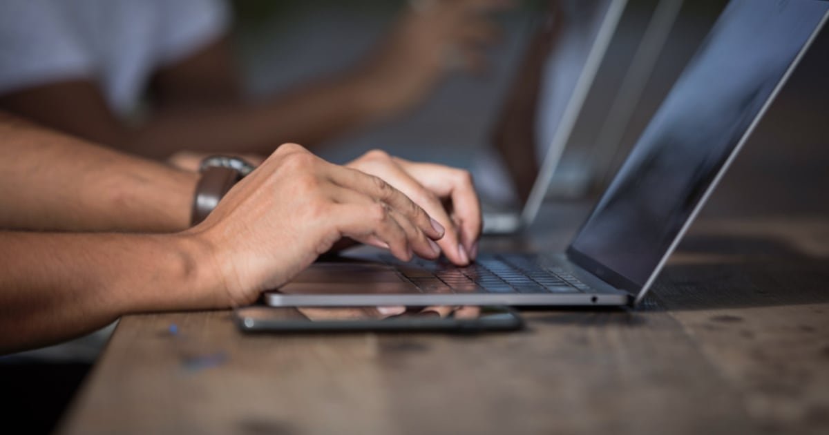Someone working at a laptop