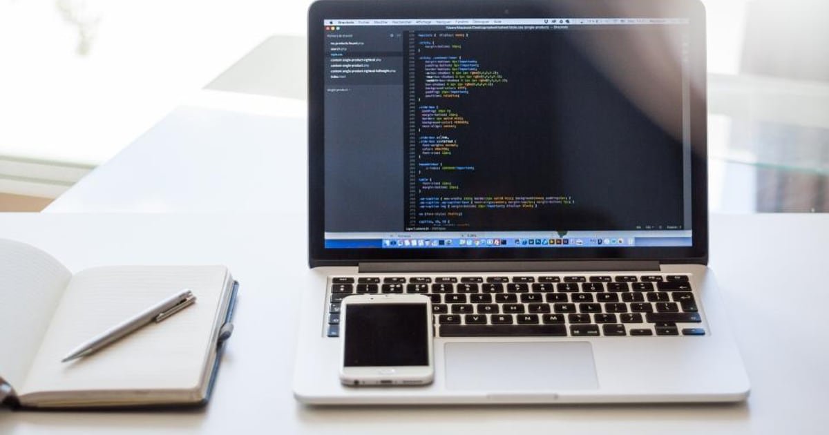 A laptop open on a desk