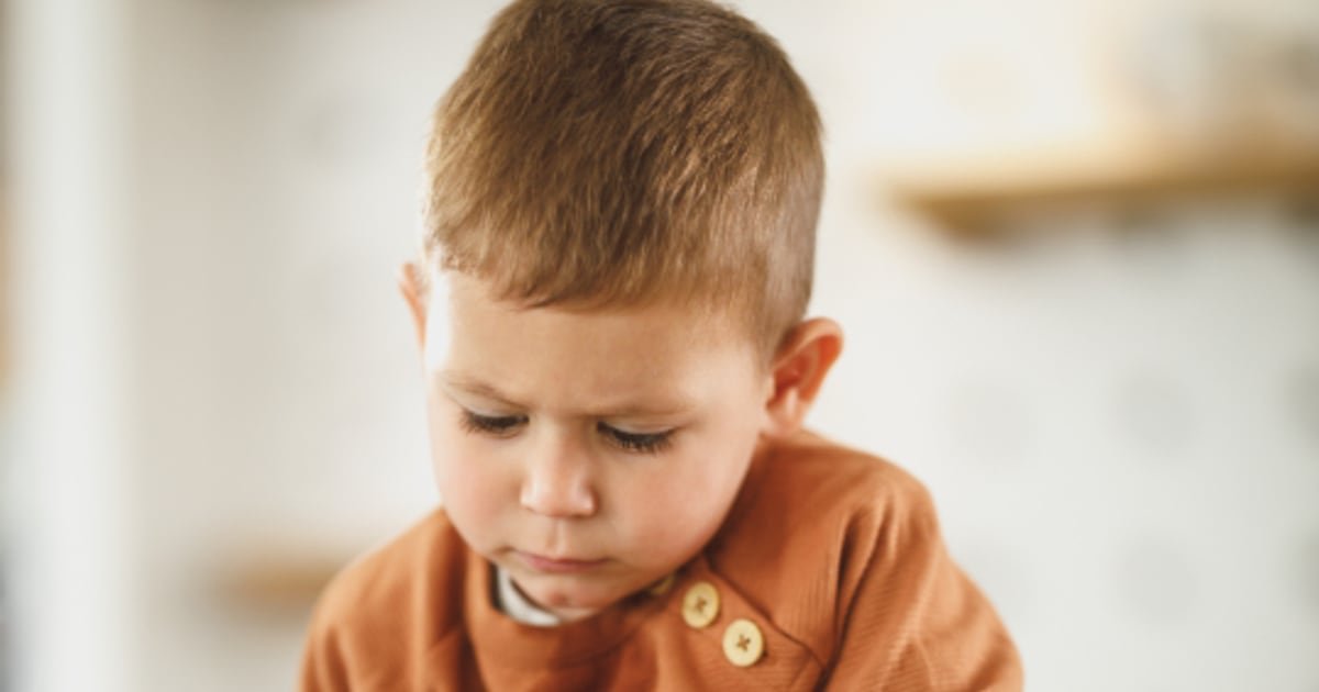 A young child using a touchscreen