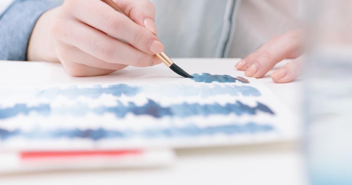 A painter working on a canvas