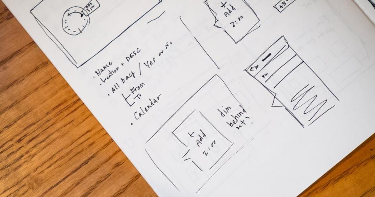 An open notepad and pen